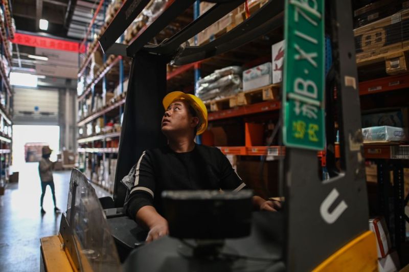 In this picture taken on November 6, 2020, an employee works in the warehouse of Cainiao Smart Logistics Network, the logistics affiliate of e-commerce giant Alibaba, in Wuxi, China's eastern Jiangsu province, ahead of Singles' Day, also known as the Double 11 shopping festival - the world's biggest shopping event - which falls on November 11.
